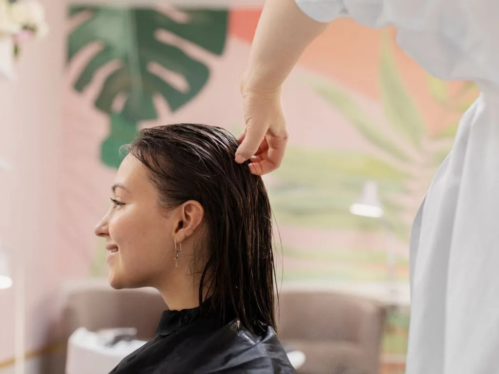 woman in salon for scalp treatment